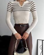 Pull uni  en maille côtelée 